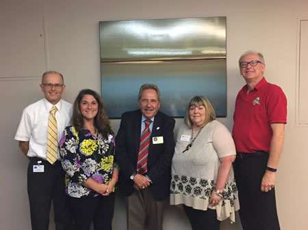 HSS Executive Director Robert Cole, Jeanne Borromeo-Otty, Ed Cote, and HSS board members Jan Crawford and Bob Polansky celebrate the completion of the COA site visit.