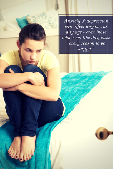 teen in bedroom with depression