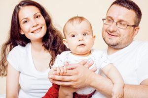 Young family with baby in a home.