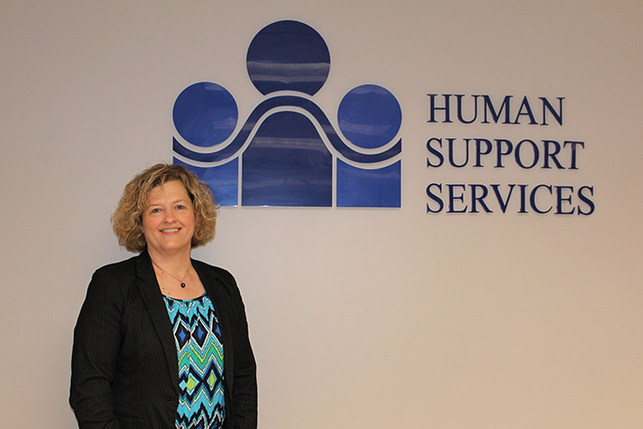 Anne King named Executive director with the logo of HSS on her back